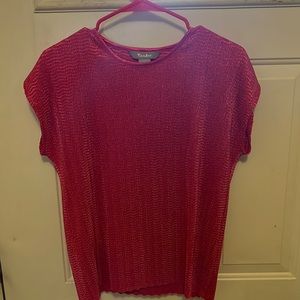 Small/petite but runs larger … feels like a medium.  Pink textured top
